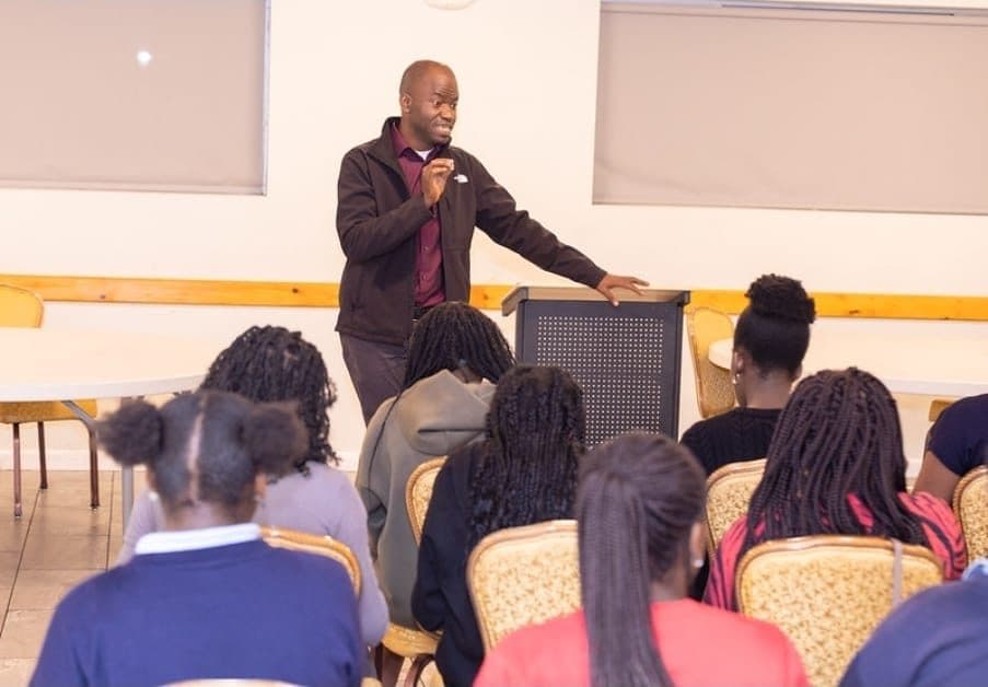 A WLIF mentor teaching a group of students