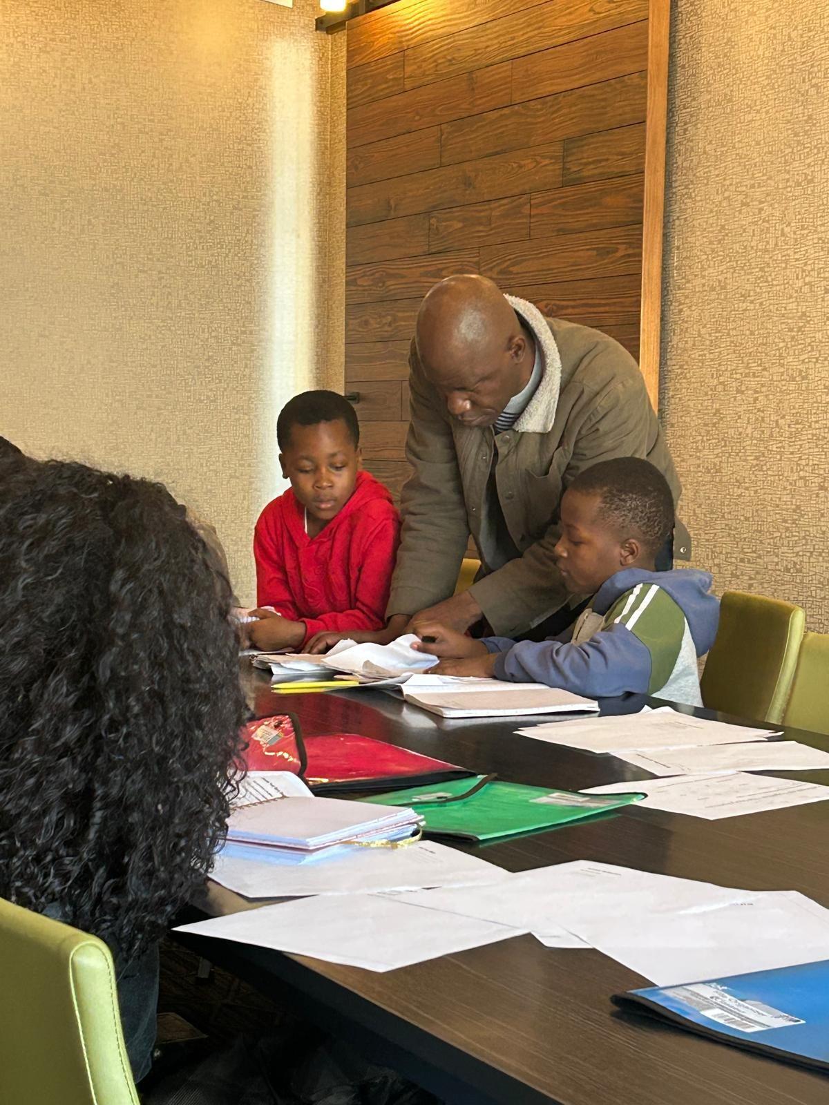 A mentor working with students