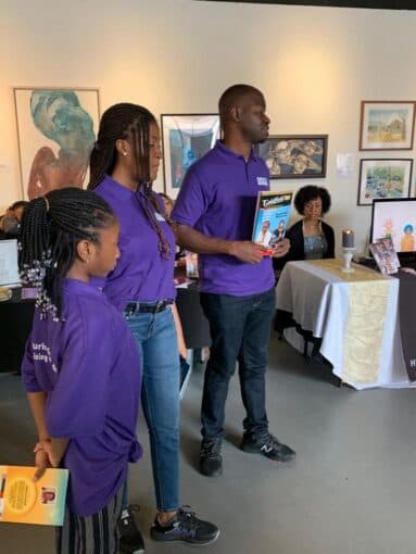 WLIF volunteers in purple shirts